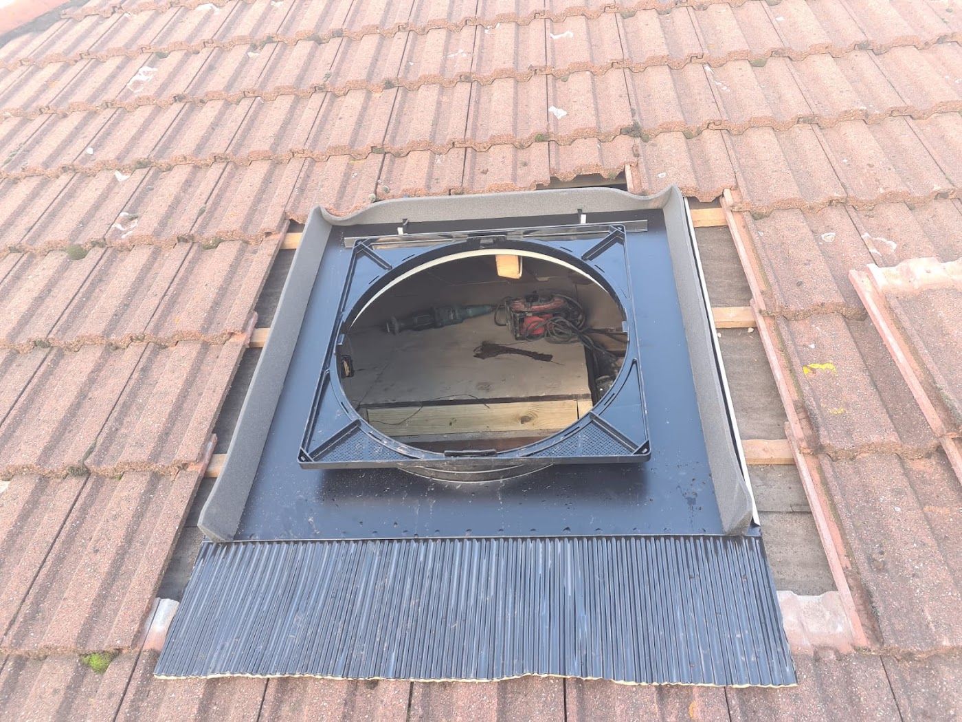Rooflight reflashed into a tiled roof
